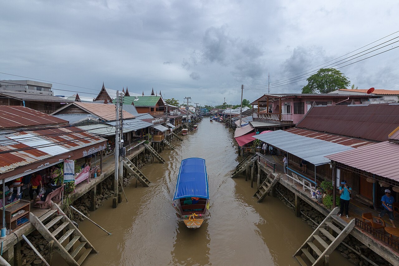 Canal and shops lining both sides of Amphawa Floating Market
