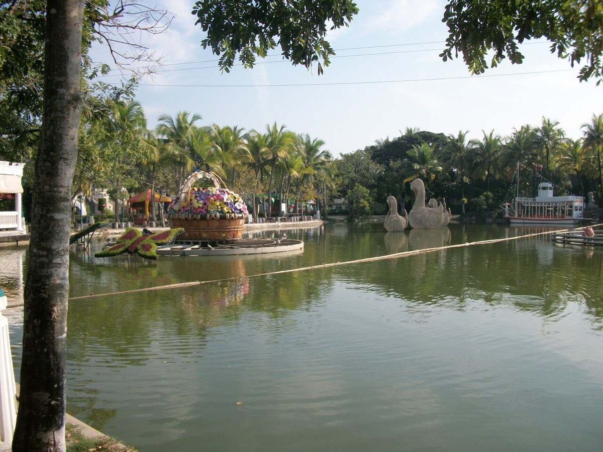 Swan-shaped decorations and park scenery by a lake at Dream World