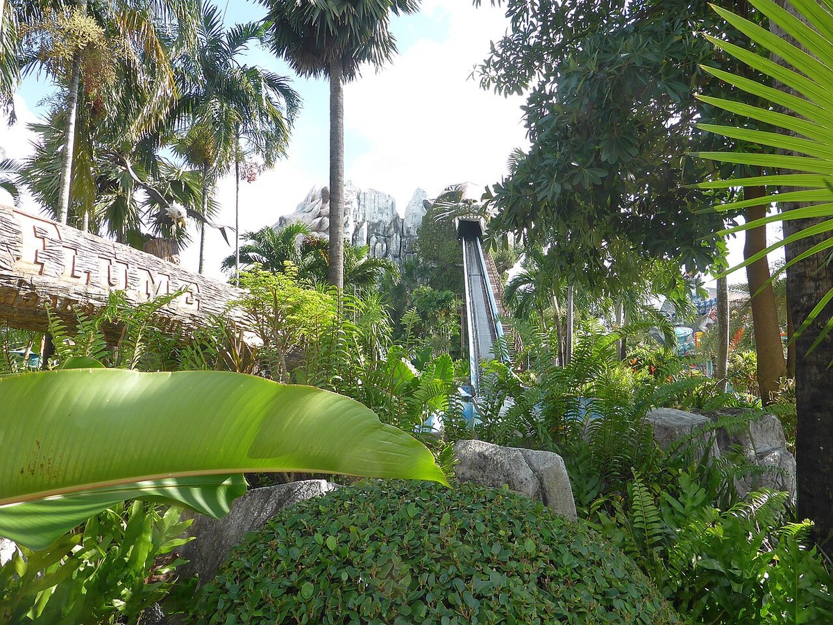 A ride visible among the trees at Siam Amazing Park