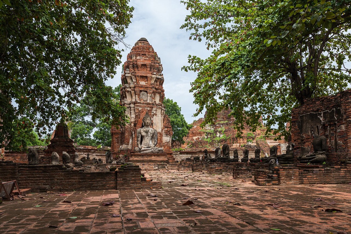 Brick remains and a Buddha image at Wat Mahathat in Ayutthaya