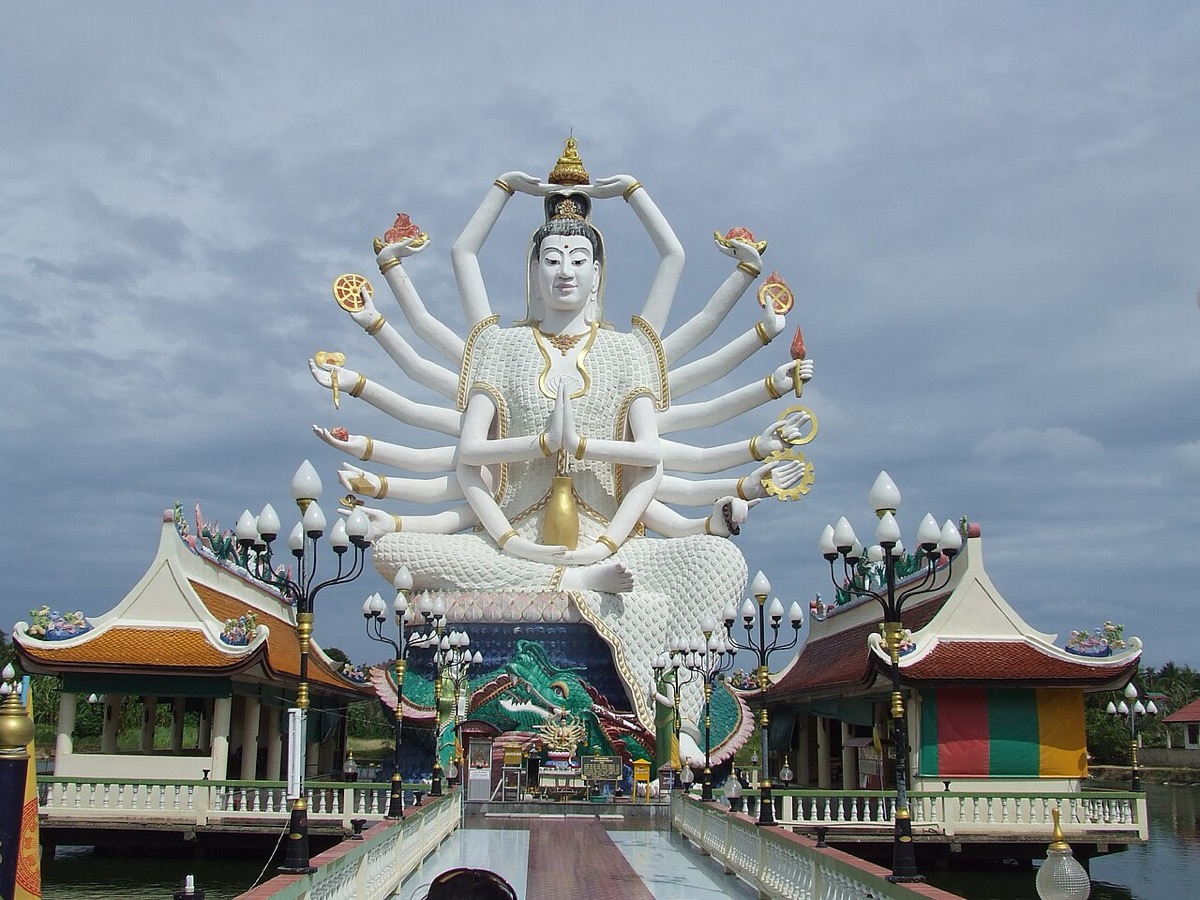 Guanyin image and bridge across the pond at Wat Plai Laem on Koh Samui