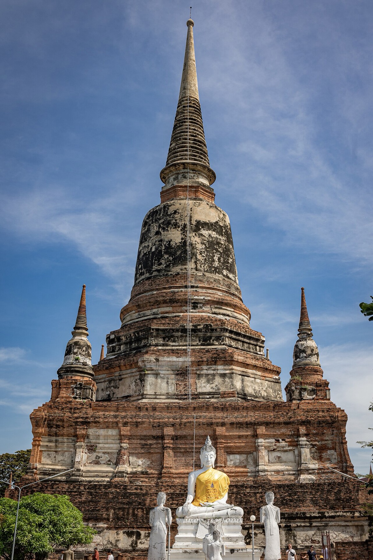 The large chedi and a Buddha image in front at Wat Yai Chai Mongkhon